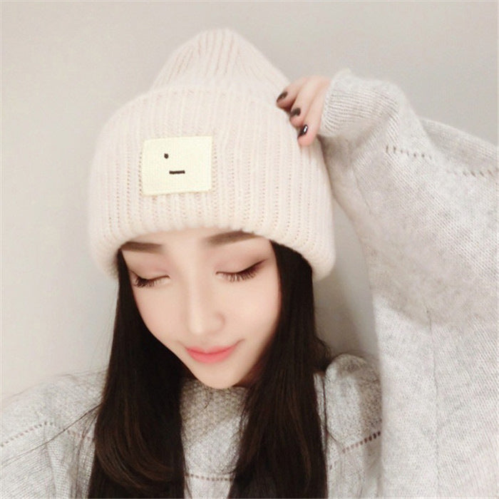 Smiley lady in knitted hat
