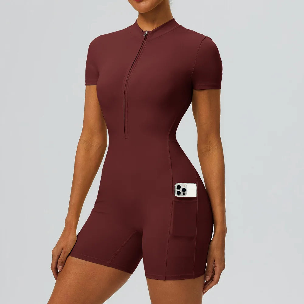 Women's zipper short sleeved yoga jumpsuit with functional pockets for hip lifting and tight fitting sports jumpsuit shorts