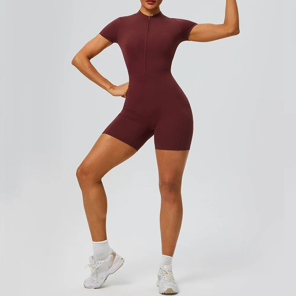 Women's zipper short sleeved yoga jumpsuit with functional pockets for hip lifting and tight fitting sports jumpsuit shorts